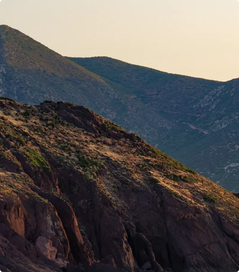 Hilly landscape with rocky terrain and a clear sky
