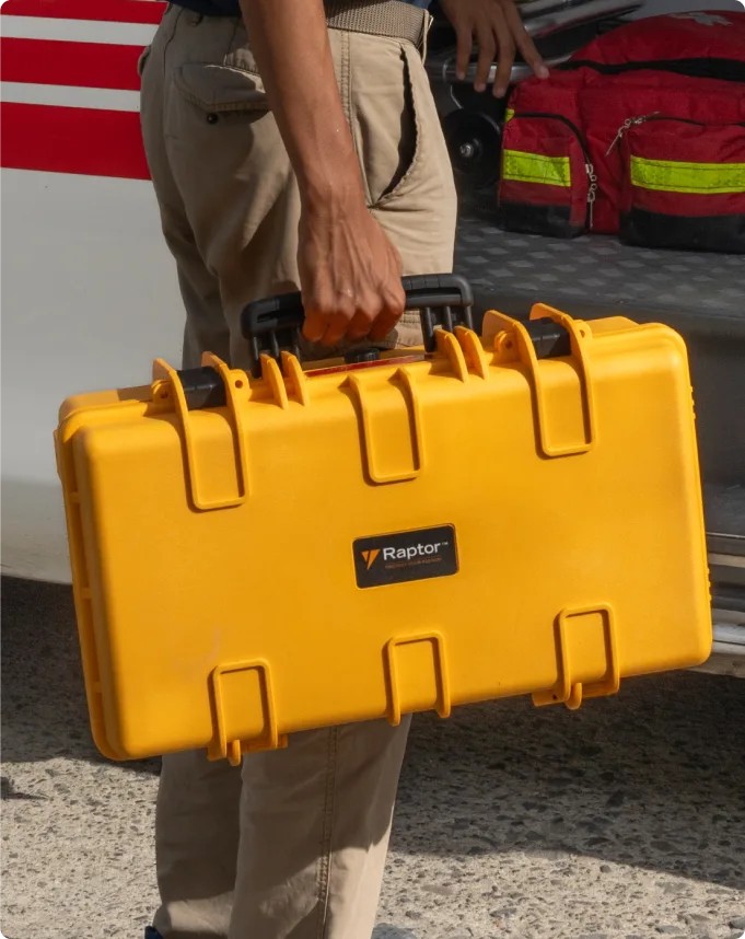 Person holding a yellow Raptor Extreme Hand Carry 